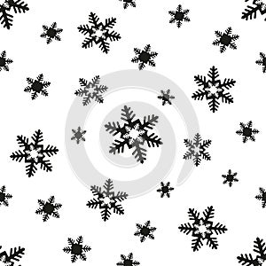 Vector seamless pattern of black-white snowflakes.